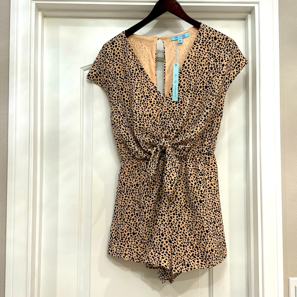 She+Sky romper. Animal print. Sexy slit in back. Size Medium